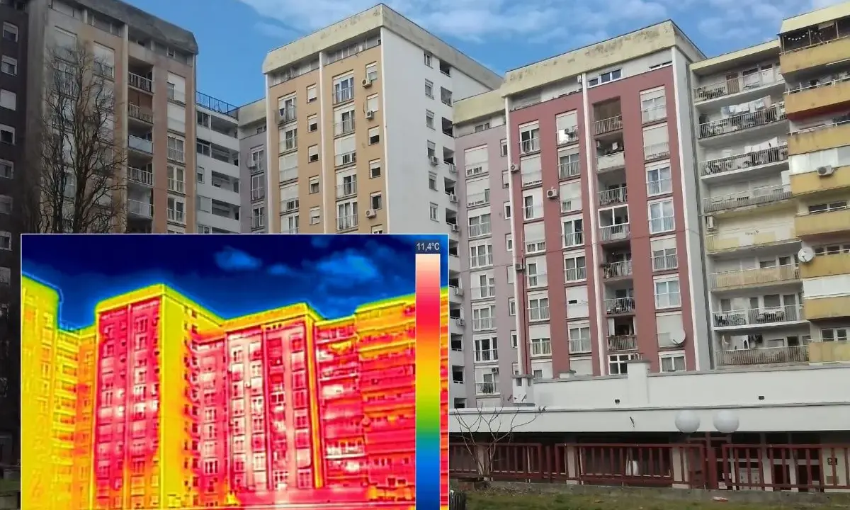Termografia di palazzi residenziali che evidenzia la trasmittanza termica periodica, con aree rosse e gialle che indicano dispersioni di calore.