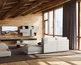 Accogliente soggiorno con travi in legno a vista, mobili chiari e vista innevata. I colori delle case di campagna si riflettono nell'arredo.